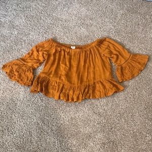 Cute rust/orange color top.